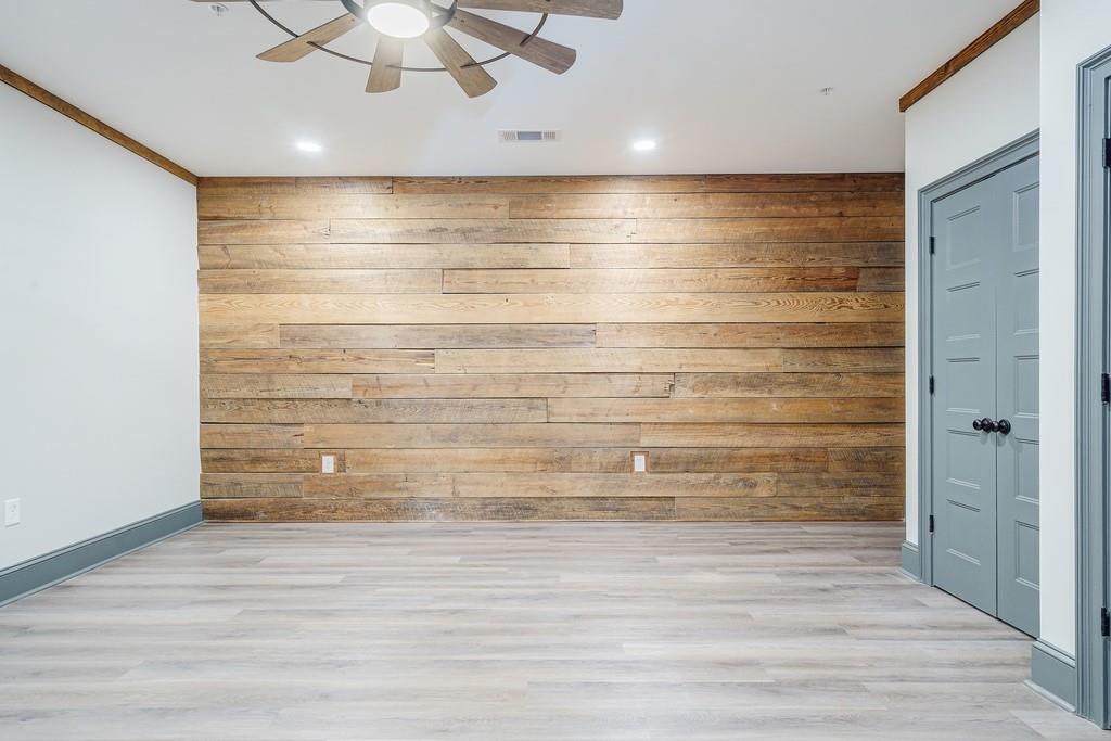 34 Depot Street, Unit 22 Hartwell, GA 30643 - Photo 8 of 29 a view of walk in closet with empty racks