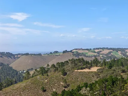 a view of a lake with mountains in the background