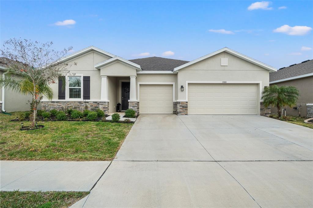 13484 Golden Lime Ave Spring Hill Spring Hill, FL 34609 - Photo 1 of 1 a view of a house with a yard and potted plants