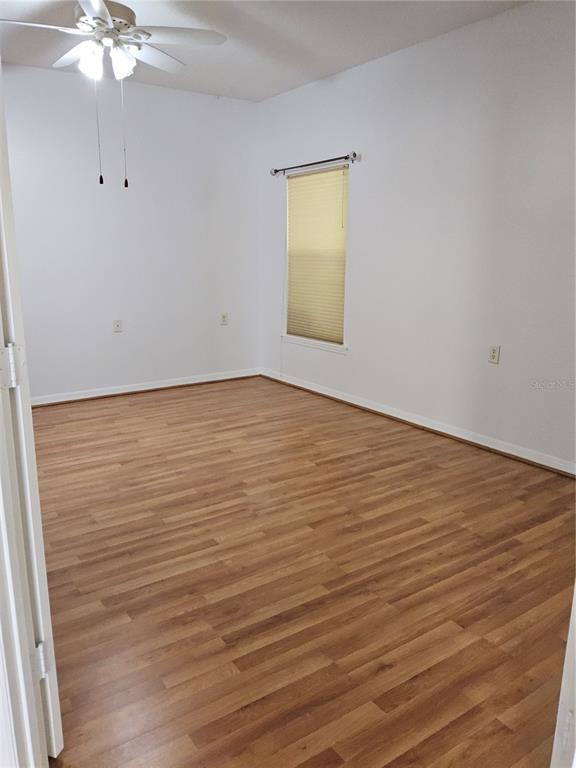 8023 St Andrews Way Mount Dora, FL 32757 - Photo 11 of 28 wooden floor in an empty room