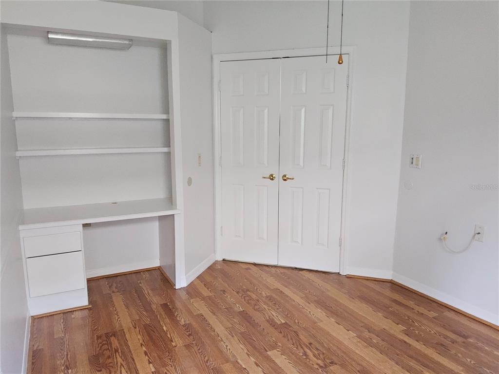 8023 St Andrews Way Mount Dora, FL 32757 - Photo 9 of 28 a view of walk in closet with empty racks