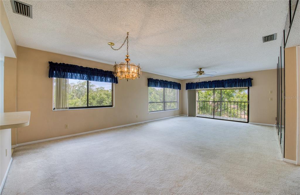 700 Starkey Road, Unit 1145 Largo, FL 33771 - Photo 9 of 63 a view of a room with large windows