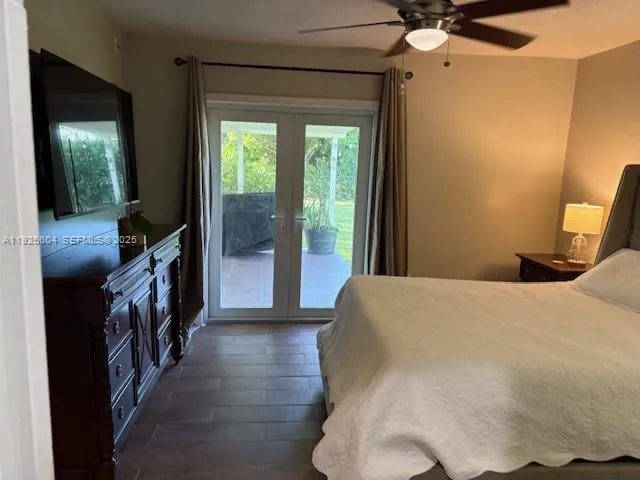 a view of a hallway to a livingroom with furniture