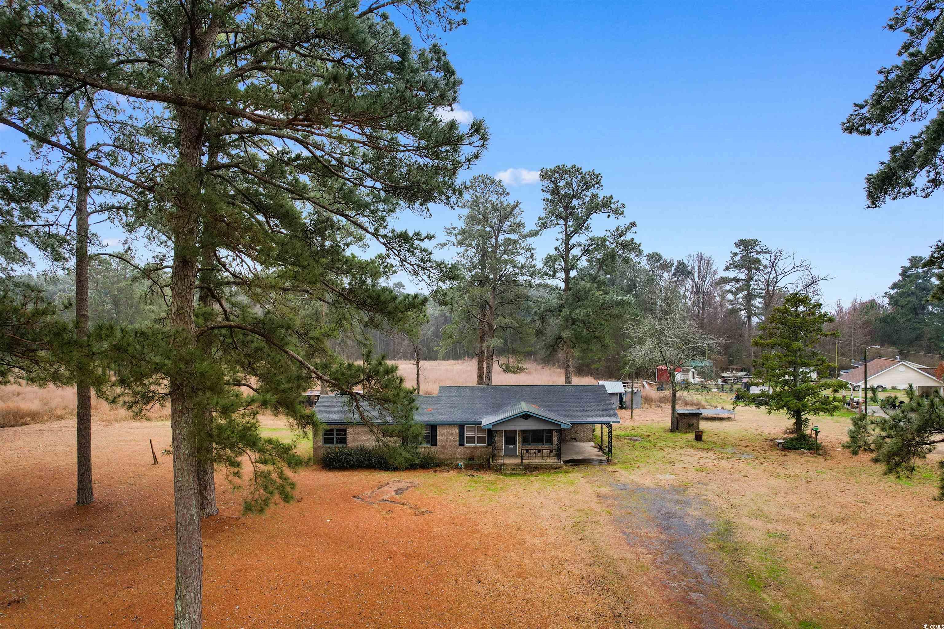 Exterior space with dirt driveway