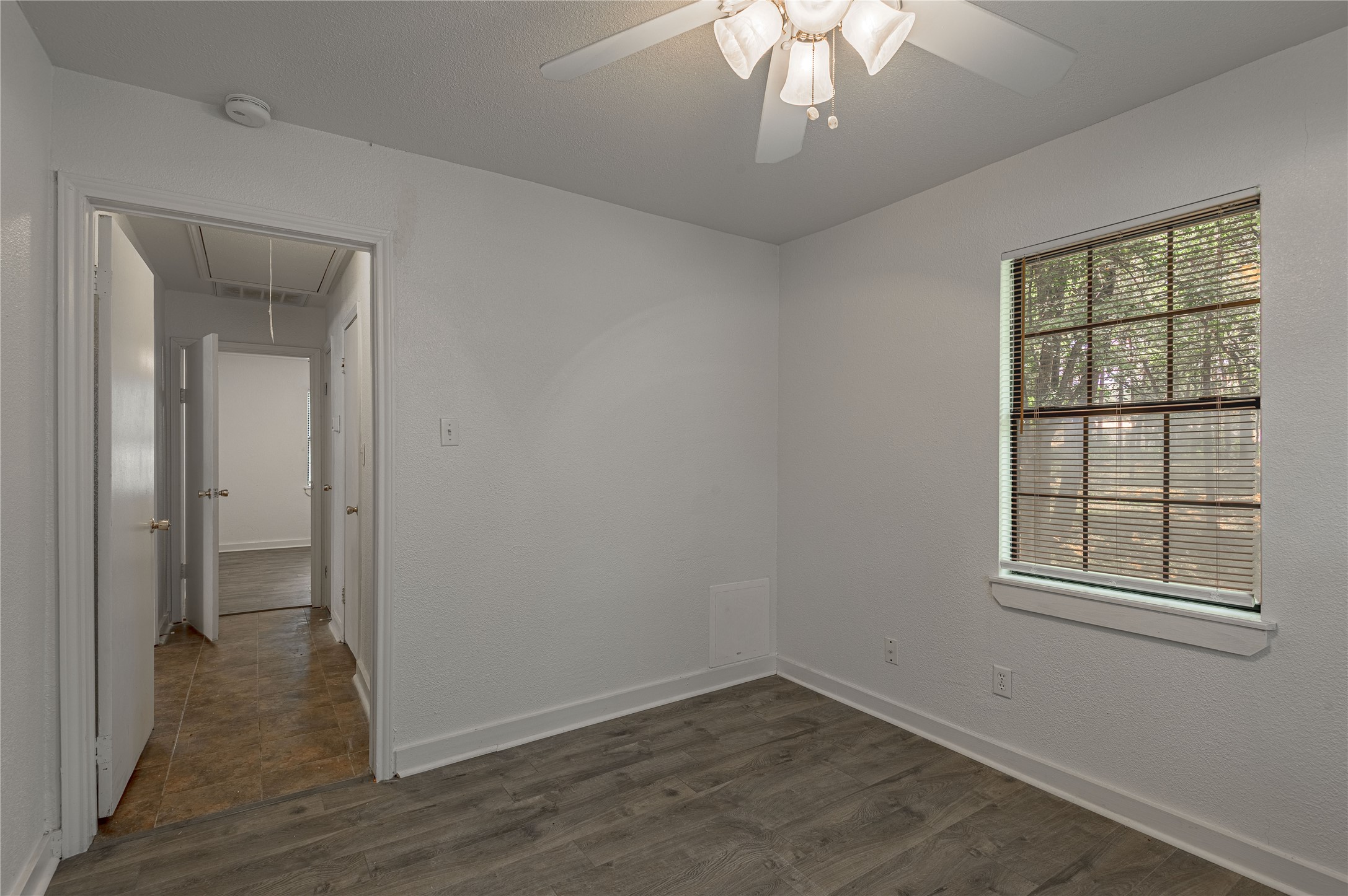7 A Hickory Lane Huntsville, TX 77340 - Photo 15 of 36 wooden floor in an empty room with a window