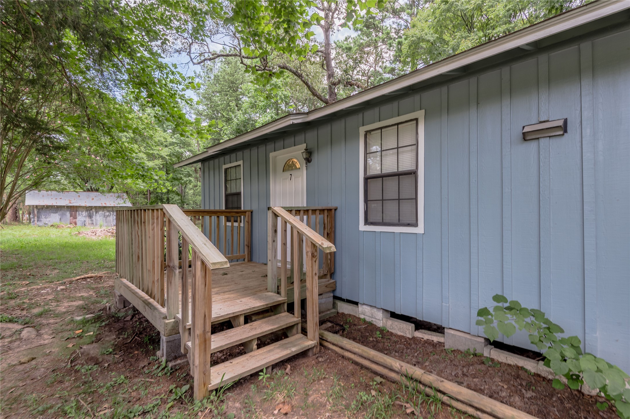 7 A Hickory Lane Huntsville, TX 77340 - Photo 21 of 36 a view of backyard with deck and outdoor seating