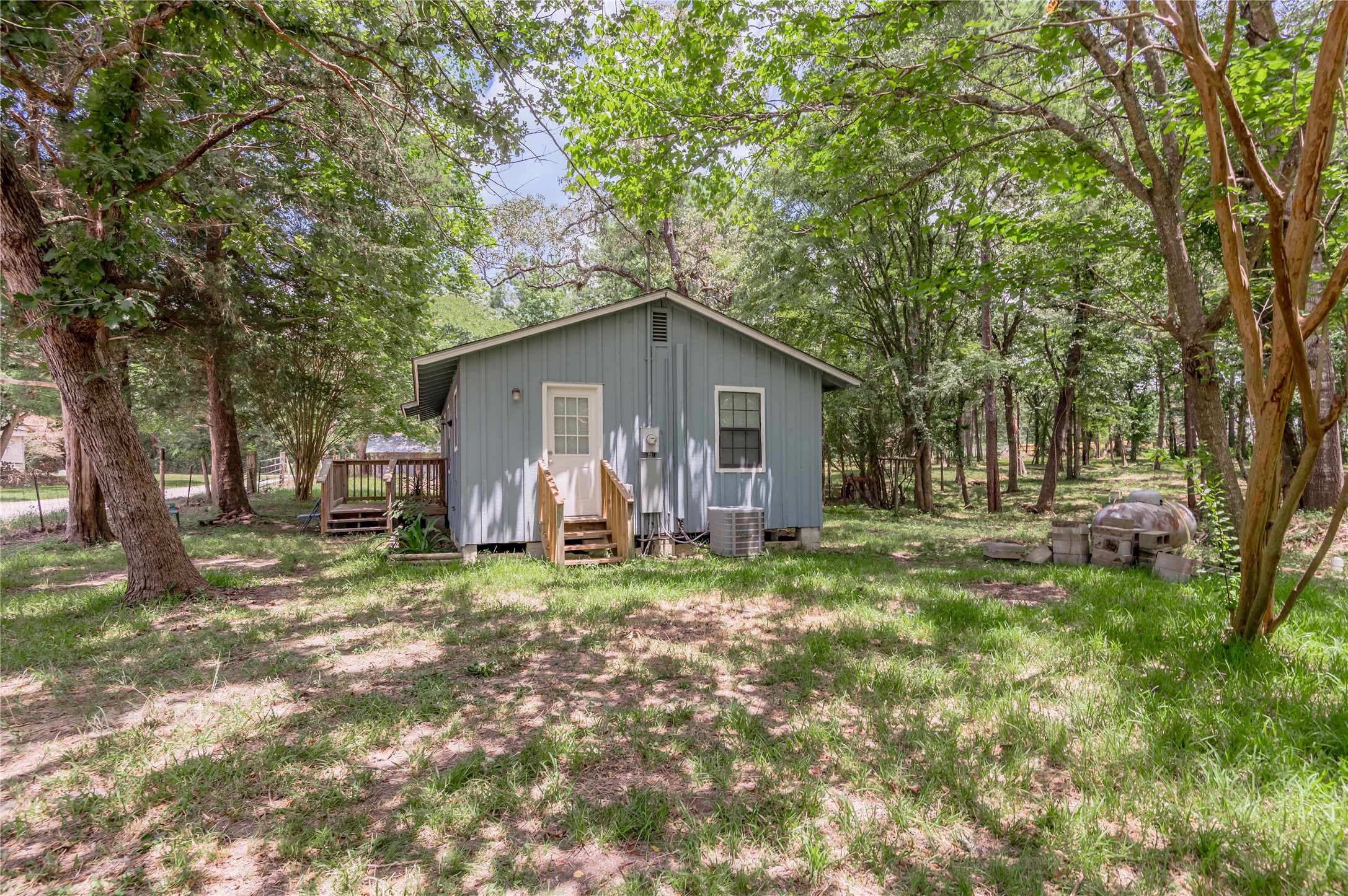 7 A Hickory Lane Huntsville, TX 77340 - Photo 30 of 36 a view of a house with backyard