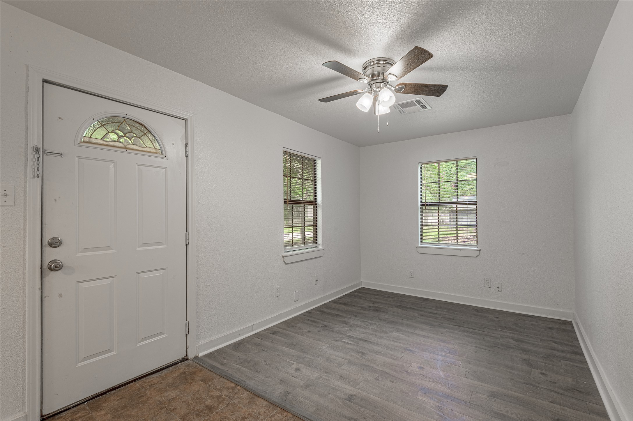 7 A Hickory Lane Huntsville, TX 77340 - Photo 4 of 36 a view of an empty room with a window
