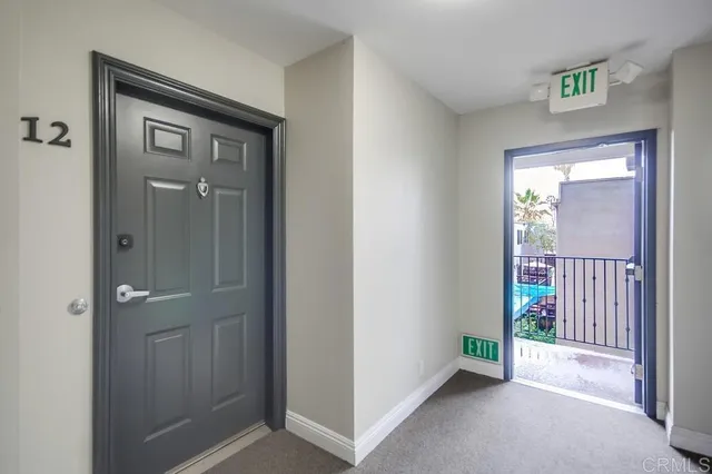 a kitchen with a refrigerator and a stove top oven