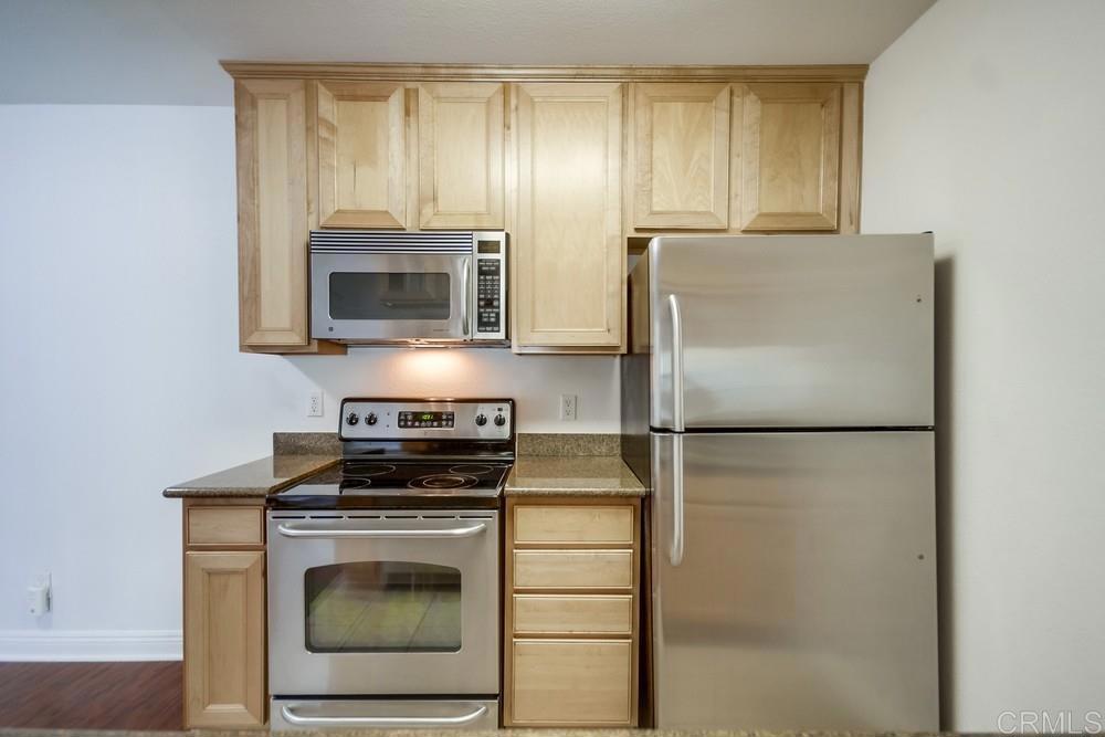 1045 Peach Avenue, Unit 12 El Cajon, CA 92021 - Photo 19 of 29 a kitchen with a refrigerator stove and microwave