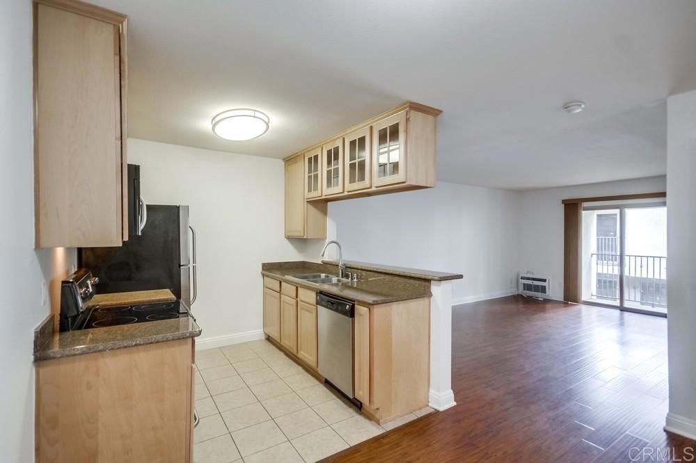 1045 Peach Avenue, Unit 12 El Cajon, CA 92021 - Photo 20 of 29 a kitchen with granite countertop a stove and a sink