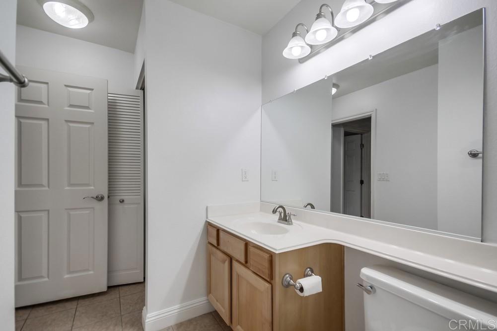 1045 Peach Avenue, Unit 12 El Cajon, CA 92021 - Photo 26 of 29 a utility room with cabinets washer and dryer