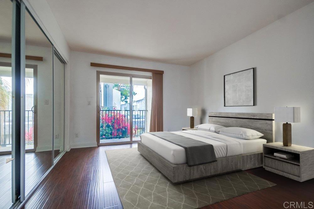 1045 Peach Avenue, Unit 12 El Cajon, CA 92021 - Photo 5 of 29 a bedroom with a balcony a bed and wooden floor