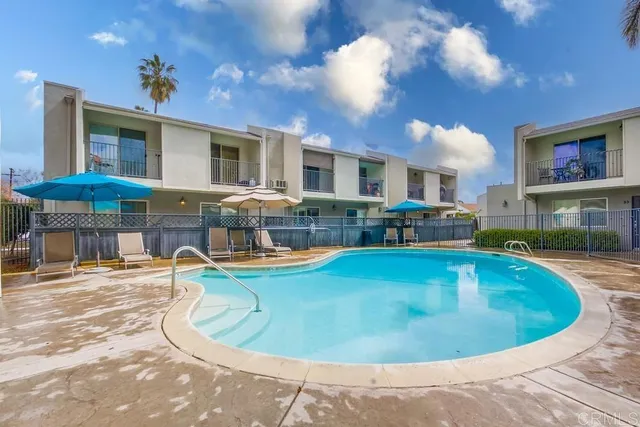 a view of a swimming pool with seating area