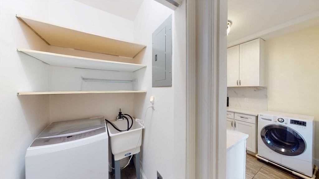 311 Tappan Street, Unit 3 Brookline, MA 02445 - Photo 18 of 35 a utility room with dryer and washer