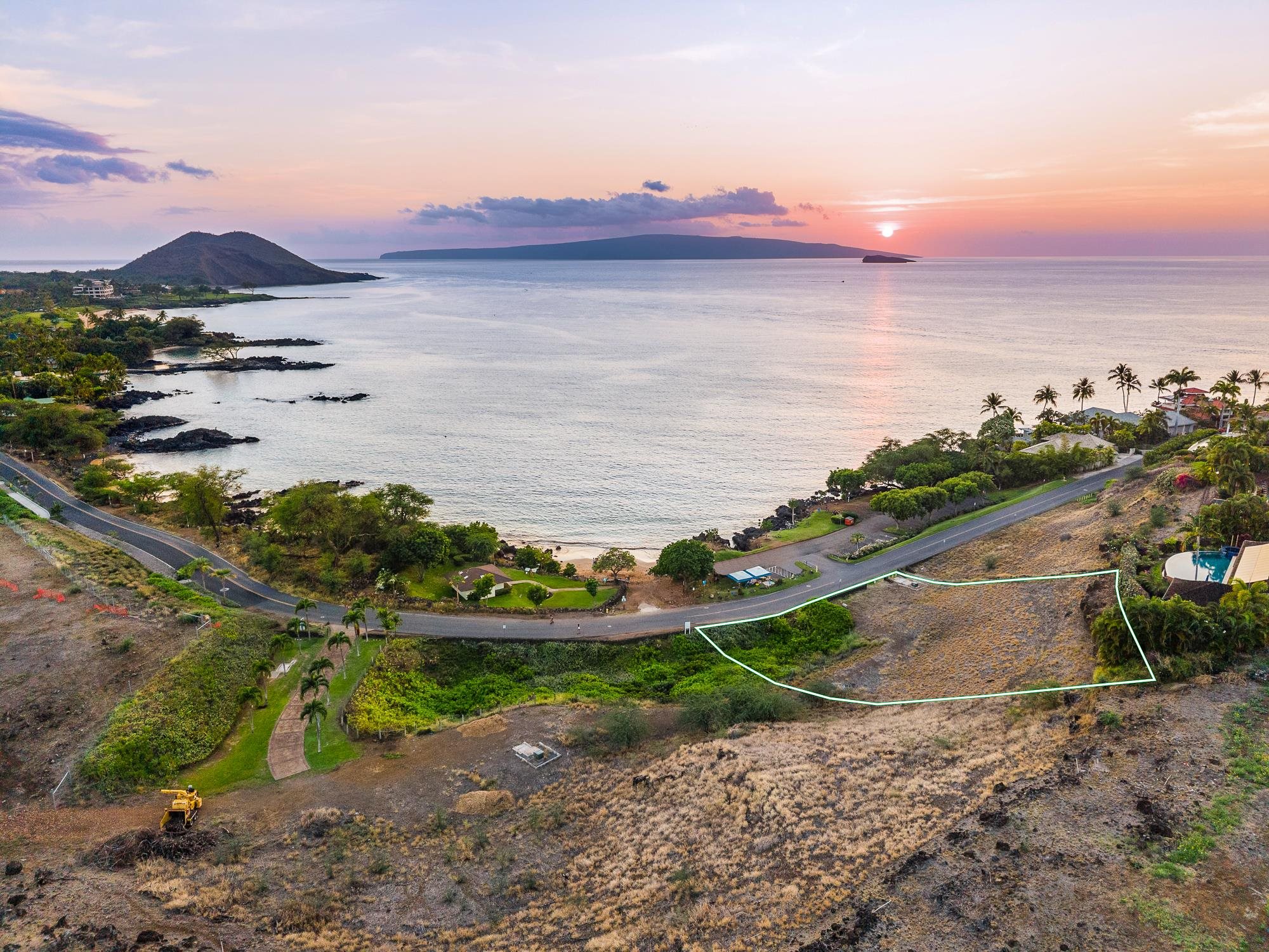5147 Makena Road, Unit 5 Kihei, HI 96753 - Photo 13 of 18 a view of a lake with a mountain in the background