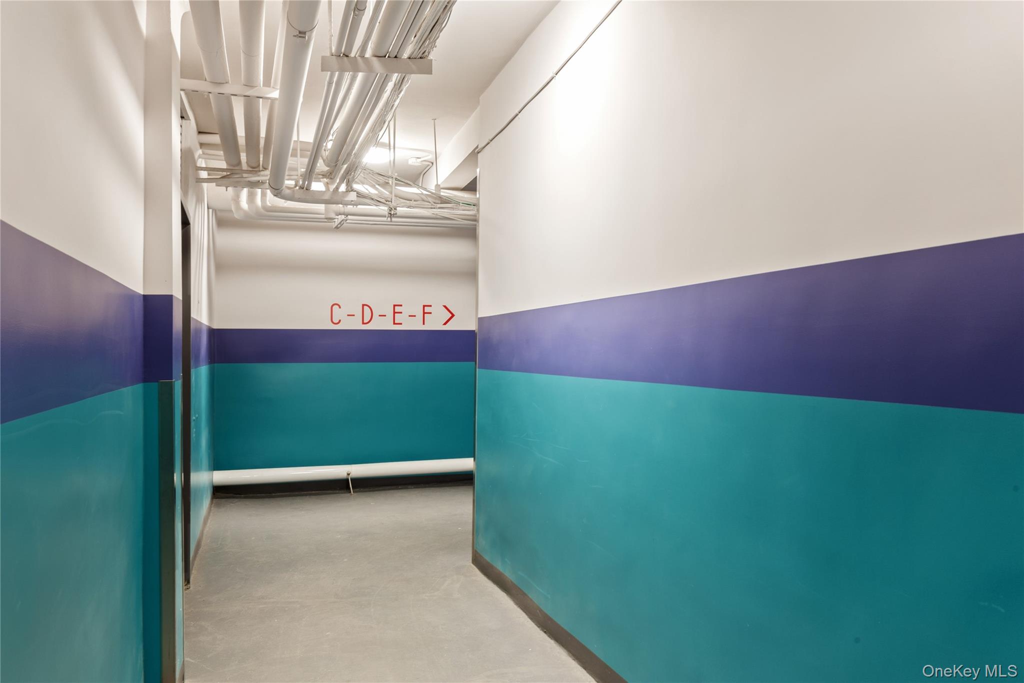 73-12 35th Avenue, Unit D44 Queens, NY 11372 - Photo 12 of 17 Hall featuring baseboards