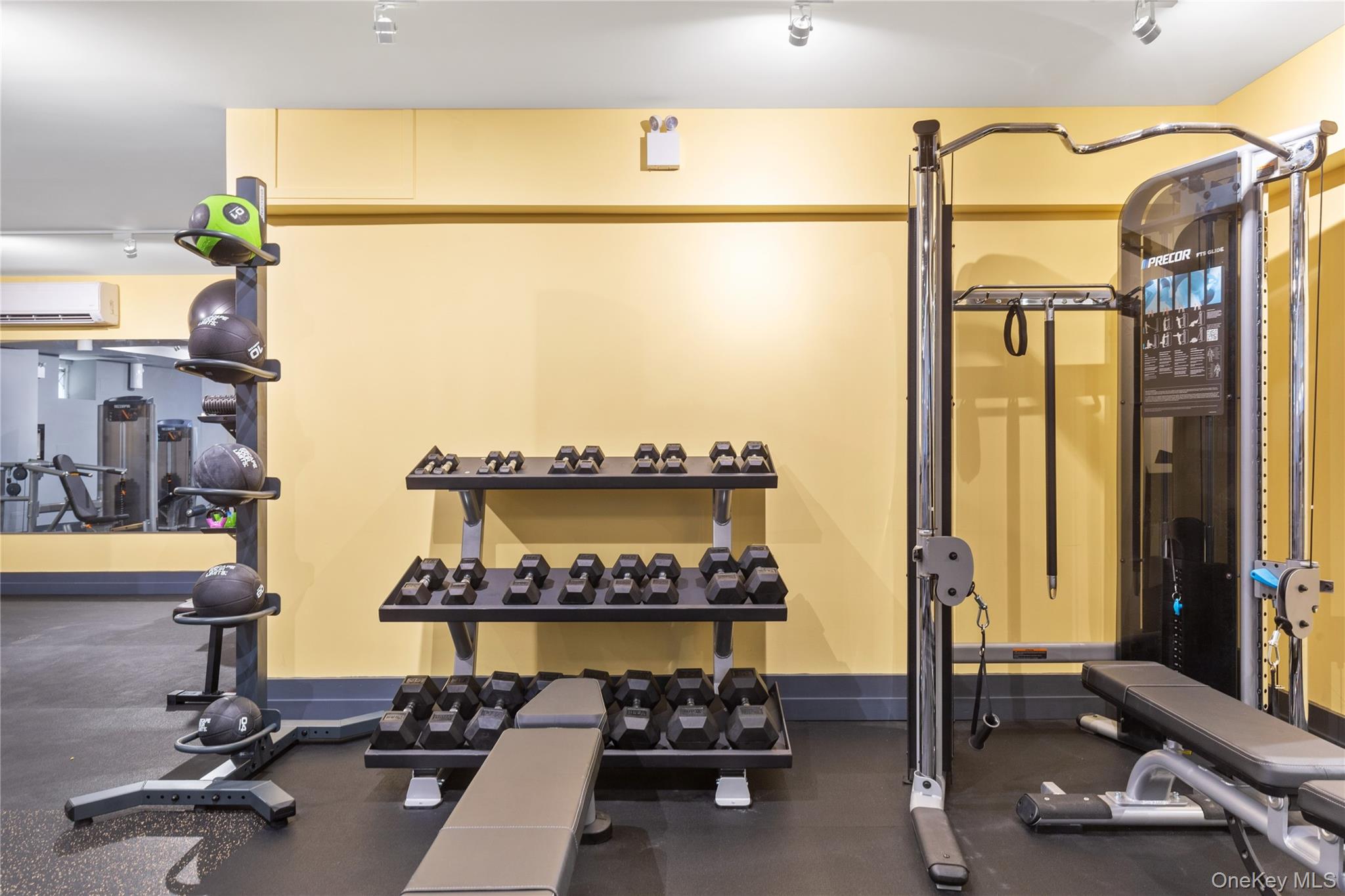 73-12 35th Avenue, Unit D44 Queens, NY 11372 - Photo 9 of 17 Workout area with an AC wall unit