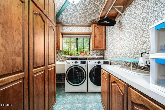 a view of a house with swimming pool and chairs