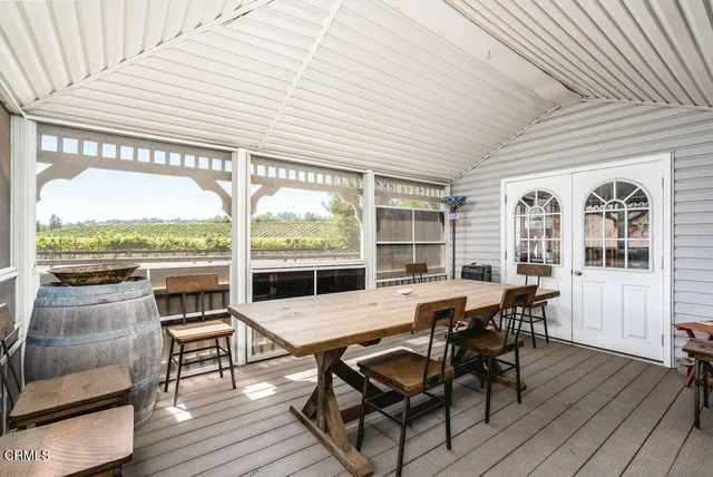 a view of a swimming pool with outdoor seating