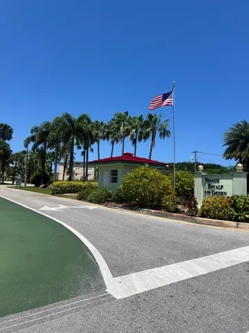 a view of a street with a building in the background