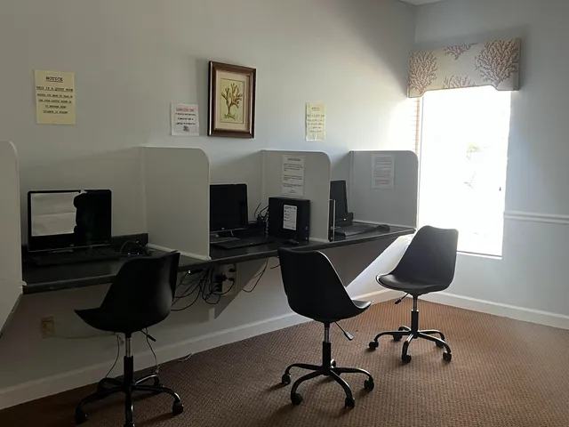 a view of a workspace with furniture