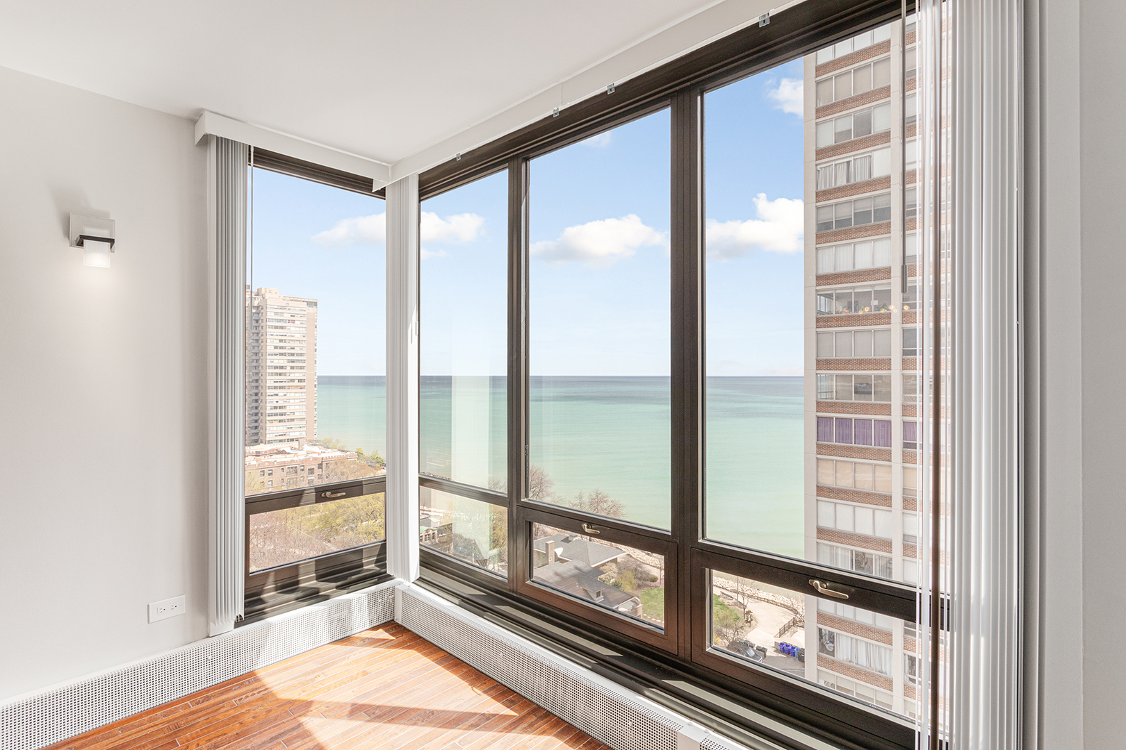 6166 North Sheridan Road, Unit 14F Chicago, IL 60660 - Photo 4 of 23 a view of an empty room and window
