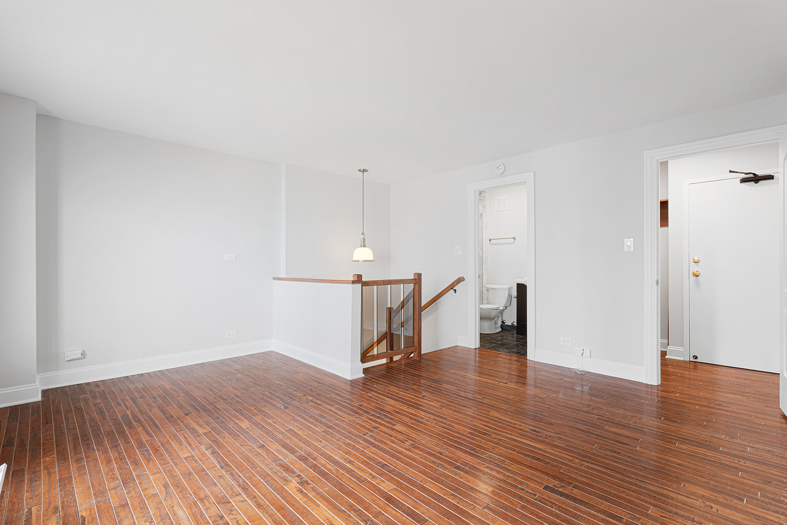6166 North Sheridan Road, Unit 14F Chicago, IL 60660 - Photo 5 of 23 a view of a room with wooden floor
