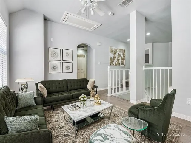 a living room with furniture and a window