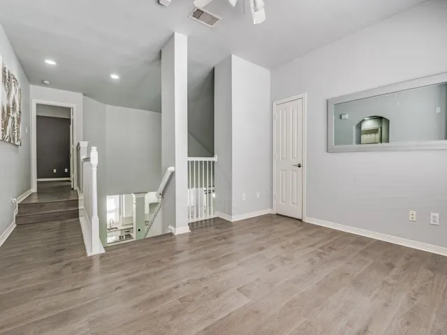 a view of entryway with wooden floor