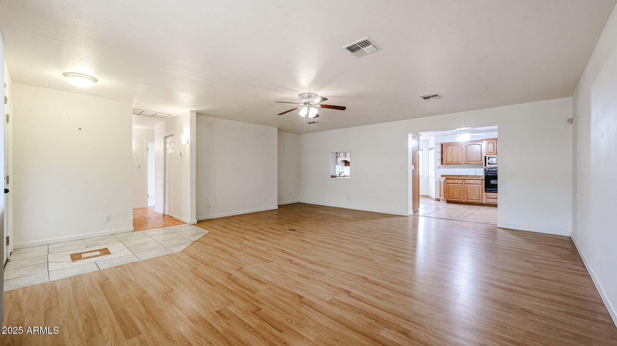 11851 North Thunderbird Road Sun City, AZ 85351 - Photo 7 of 46 a view of an empty room and wooden floor