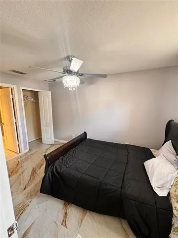 a bedroom with a bed and dresser