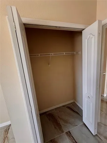 a view of a room with wooden floor and staircase