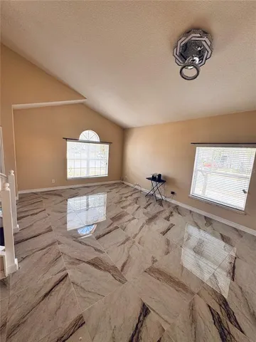 a bed room with a bed and a window