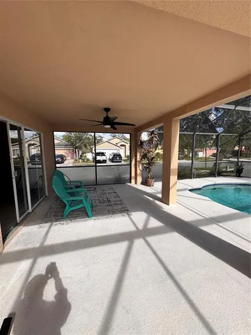 a view of a swimming pool with a patio