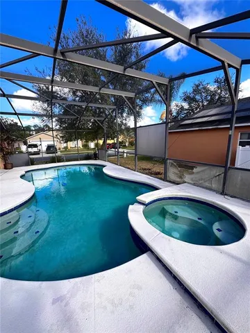 a view of a swimming pool with a chairs