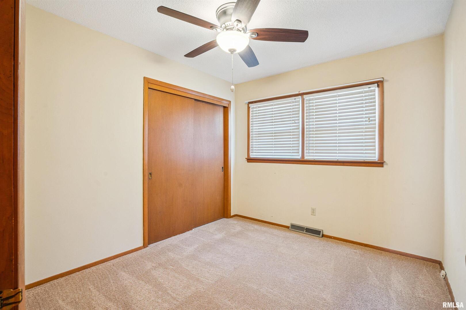 8101 8th Street West Rock Island, IL 61201 - Photo 11 of 25 a view of an empty room with a window