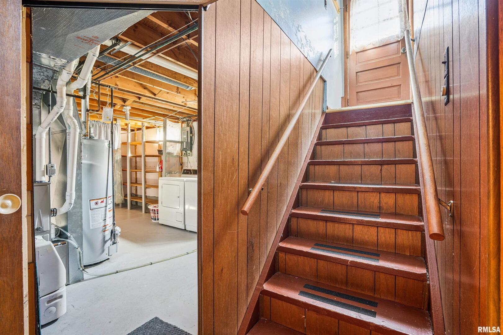 8101 8th Street West Rock Island, IL 61201 - Photo 17 of 25 a view of staircase with wooden floor and a view of bedroom
