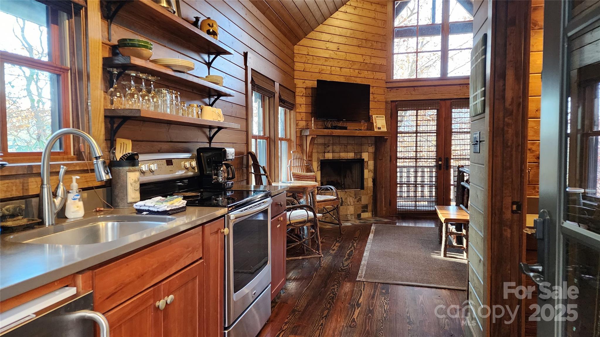 5 Chaucer Road Black Mountain, NC 28711 - Photo 12 of 48 a kitchen with stainless steel appliances granite countertop a stove top oven a sink dishwasher and a microwave oven with cabinets