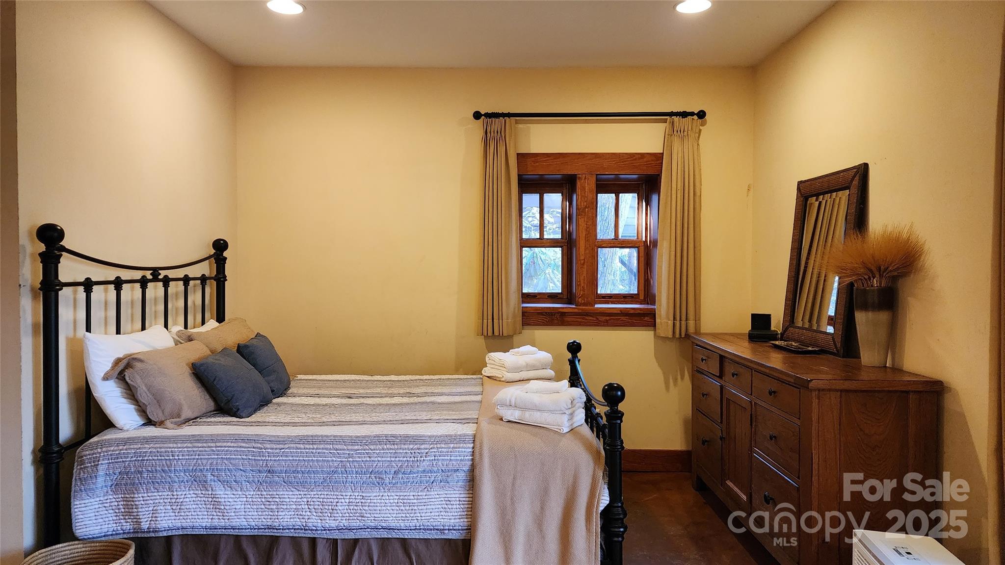 5 Chaucer Road Black Mountain, NC 28711 - Photo 21 of 48 a bedroom with a bed and dresser