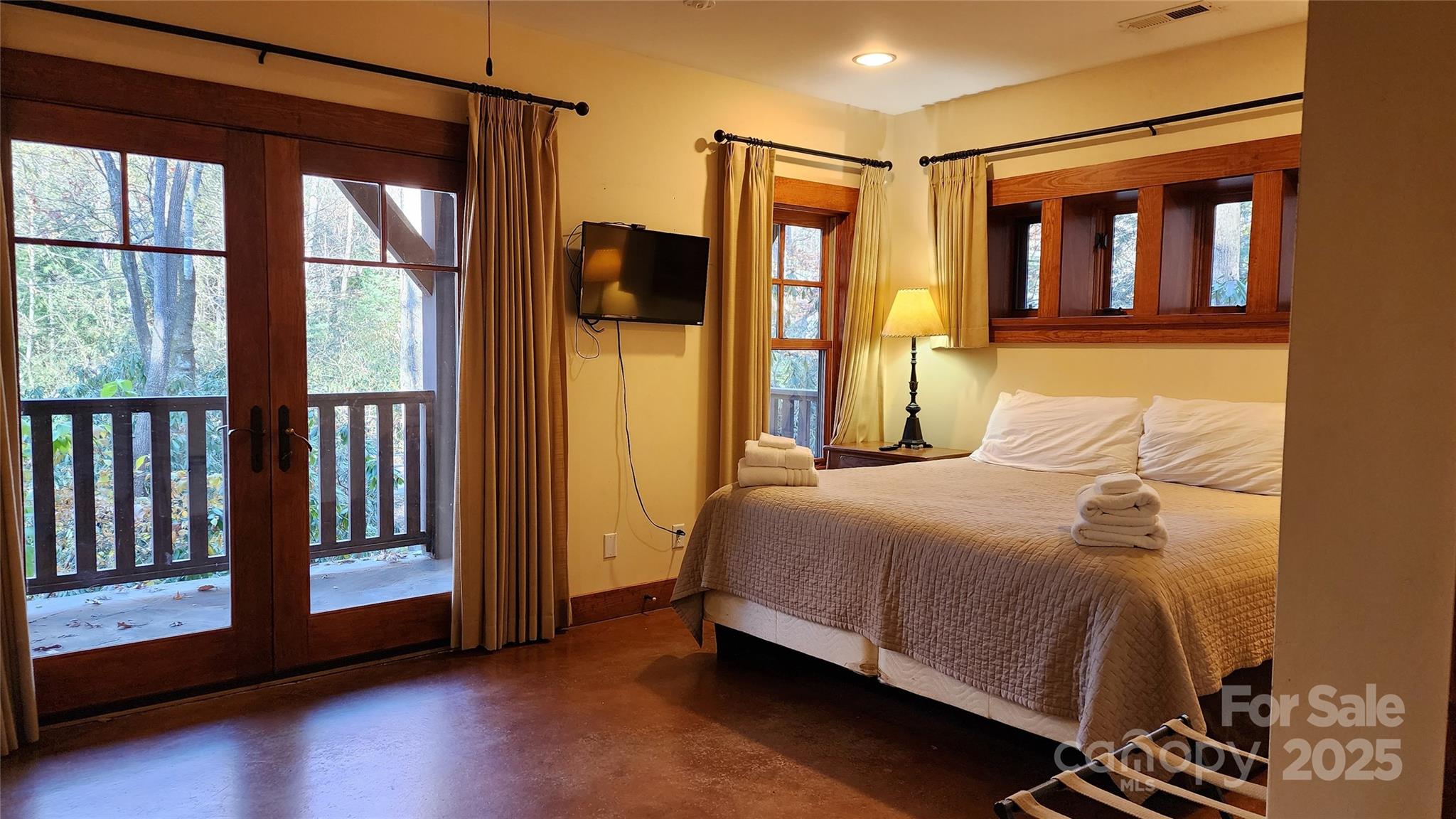 5 Chaucer Road Black Mountain, NC 28711 - Photo 23 of 48 a bedroom with a bed and wooden floor