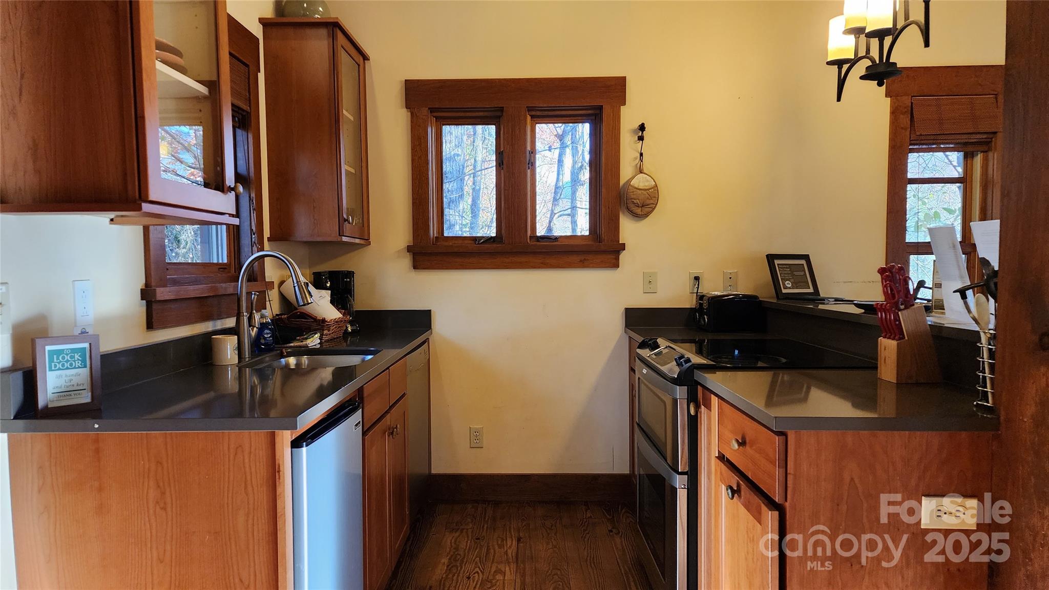 5 Chaucer Road Black Mountain, NC 28711 - Photo 25 of 48 a kitchen with a sink and a stove
