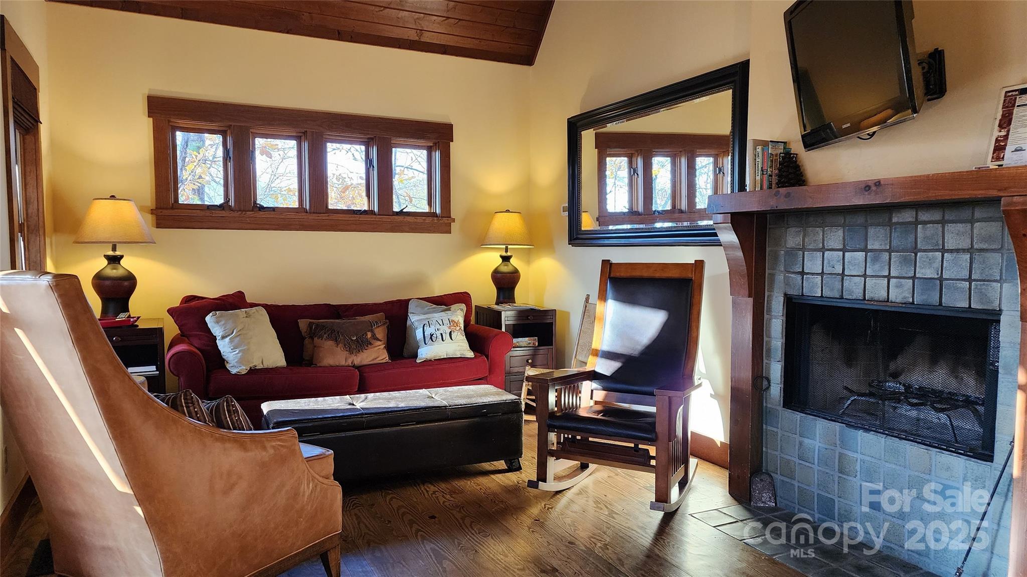 5 Chaucer Road Black Mountain, NC 28711 - Photo 27 of 48 a living room with furniture fireplace and flat screen tv