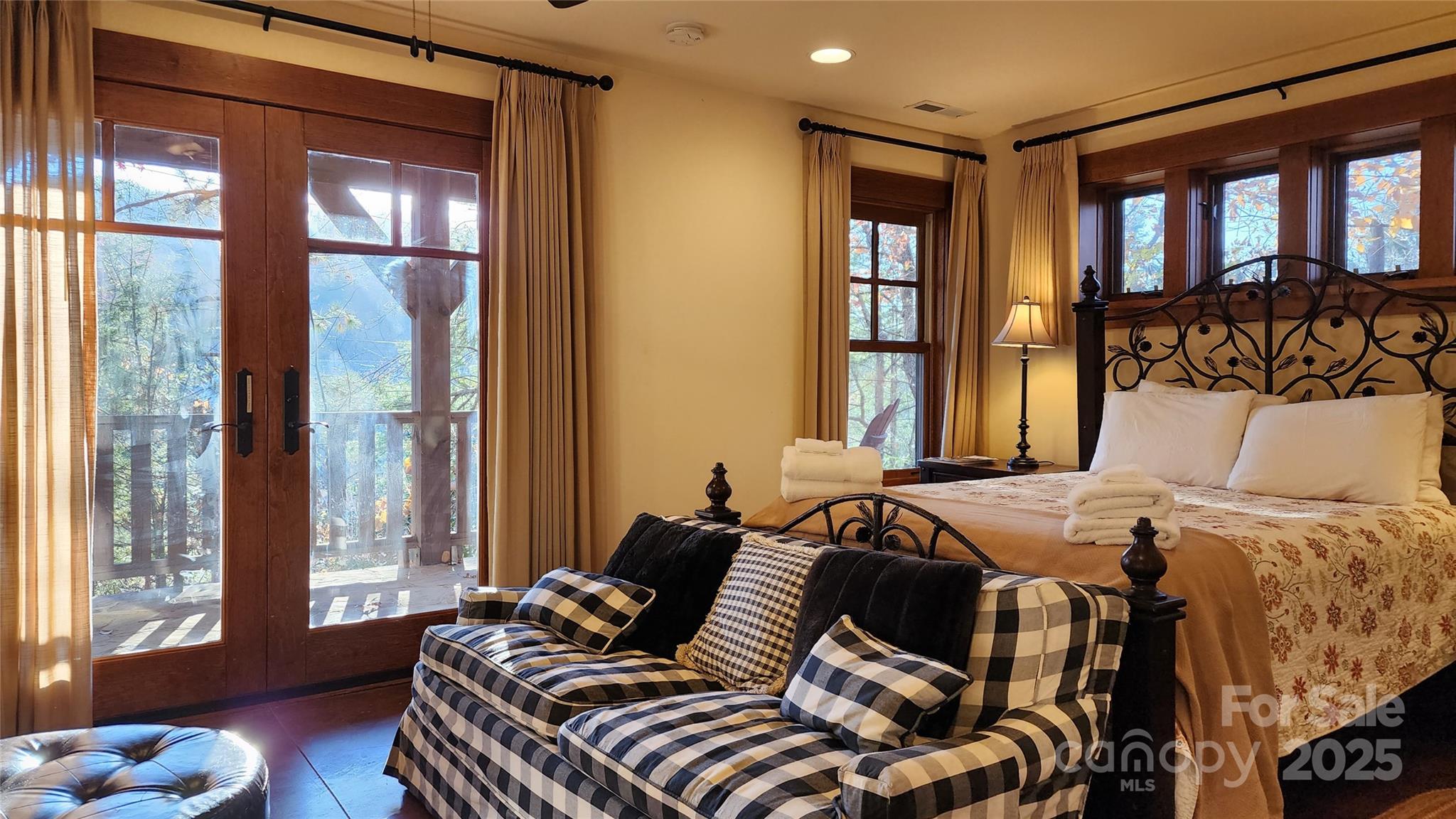 5 Chaucer Road Black Mountain, NC 28711 - Photo 31 of 48 a bedroom with a bed and glass door