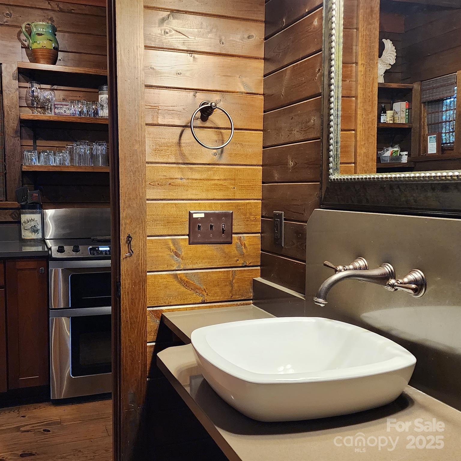 5 Chaucer Road Black Mountain, NC 28711 - Photo 34 of 48 a bathroom with a sink and a mirror
