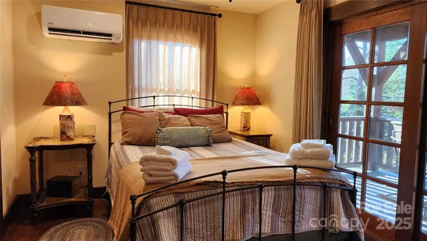 a bedroom with furniture and a fireplace