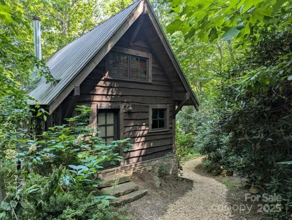 a kitchen with stainless steel appliances granite countertop a stove top oven a sink dishwasher and a microwave oven with cabinets