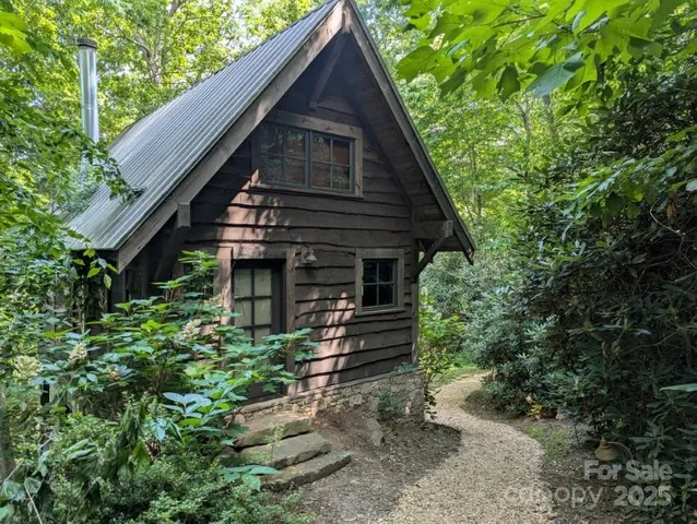 a kitchen with stainless steel appliances granite countertop a stove top oven a sink dishwasher and a microwave oven with cabinets