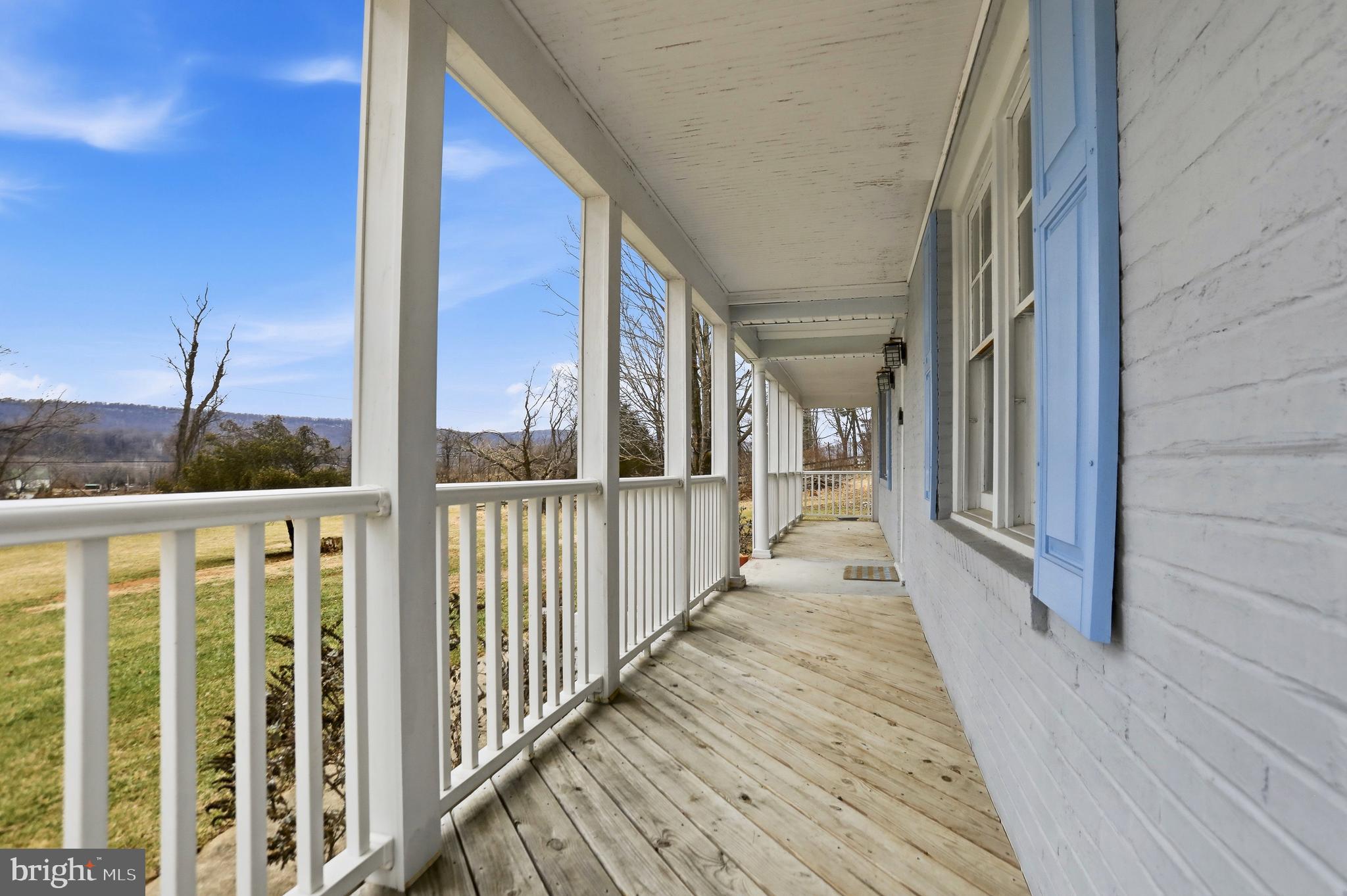 12242 Harpers Ferry Road Purcellville, VA 20132 - Photo 12 of 49 a view of a balcony with wooden floor
