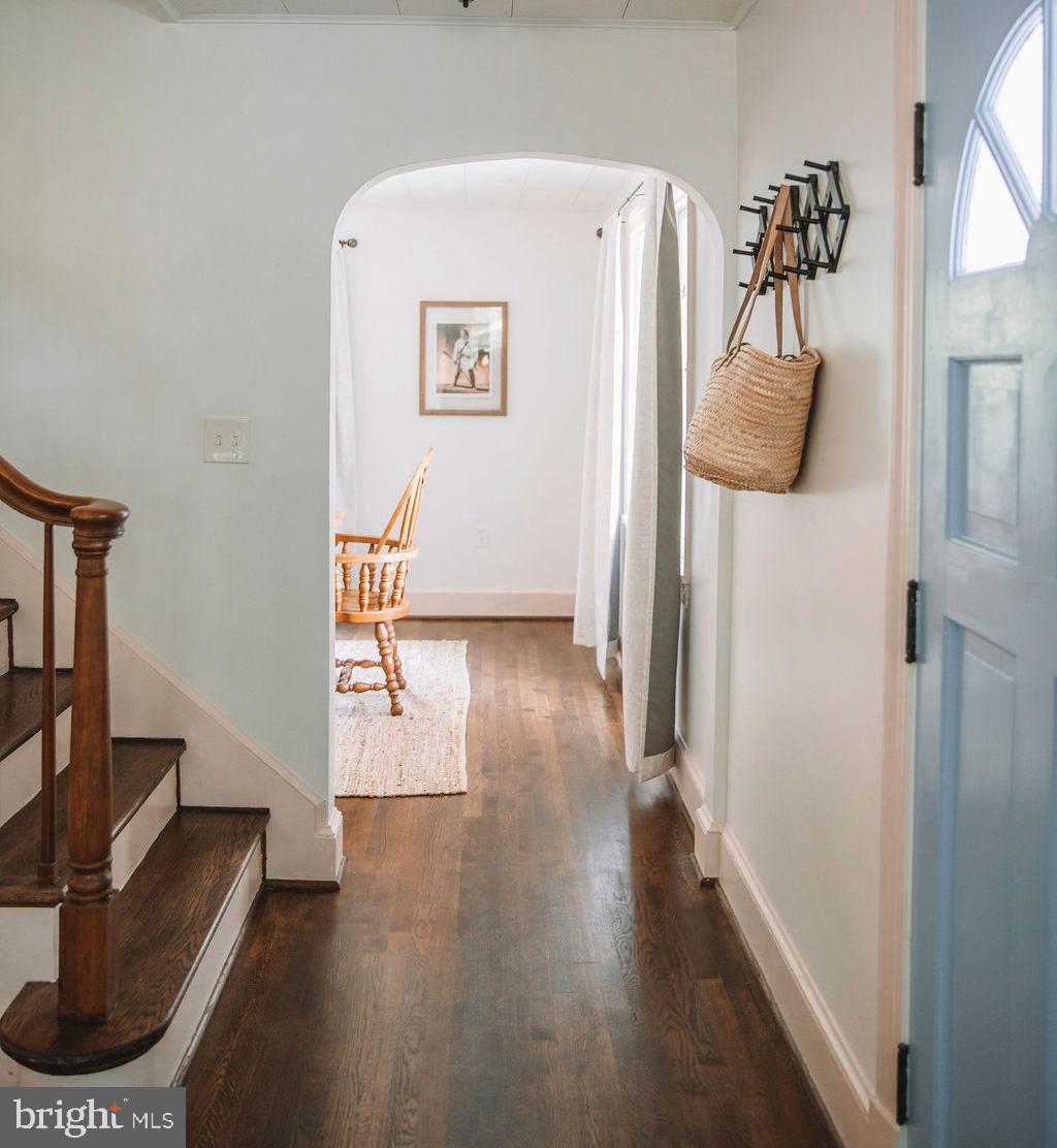 12242 Harpers Ferry Road Purcellville, VA 20132 - Photo 13 of 49 a view of a hallway with wooden floor and furniture
